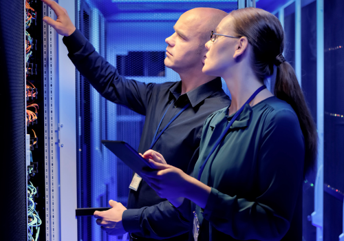two it engineers planning in a server room