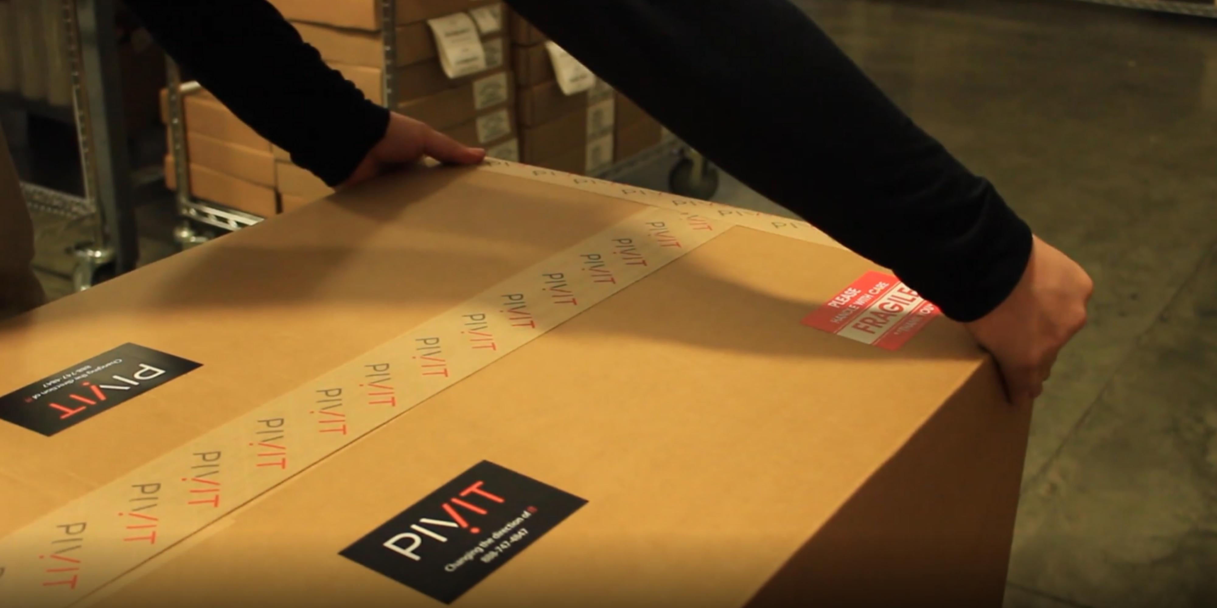 extend operations specialist applying tape to a package