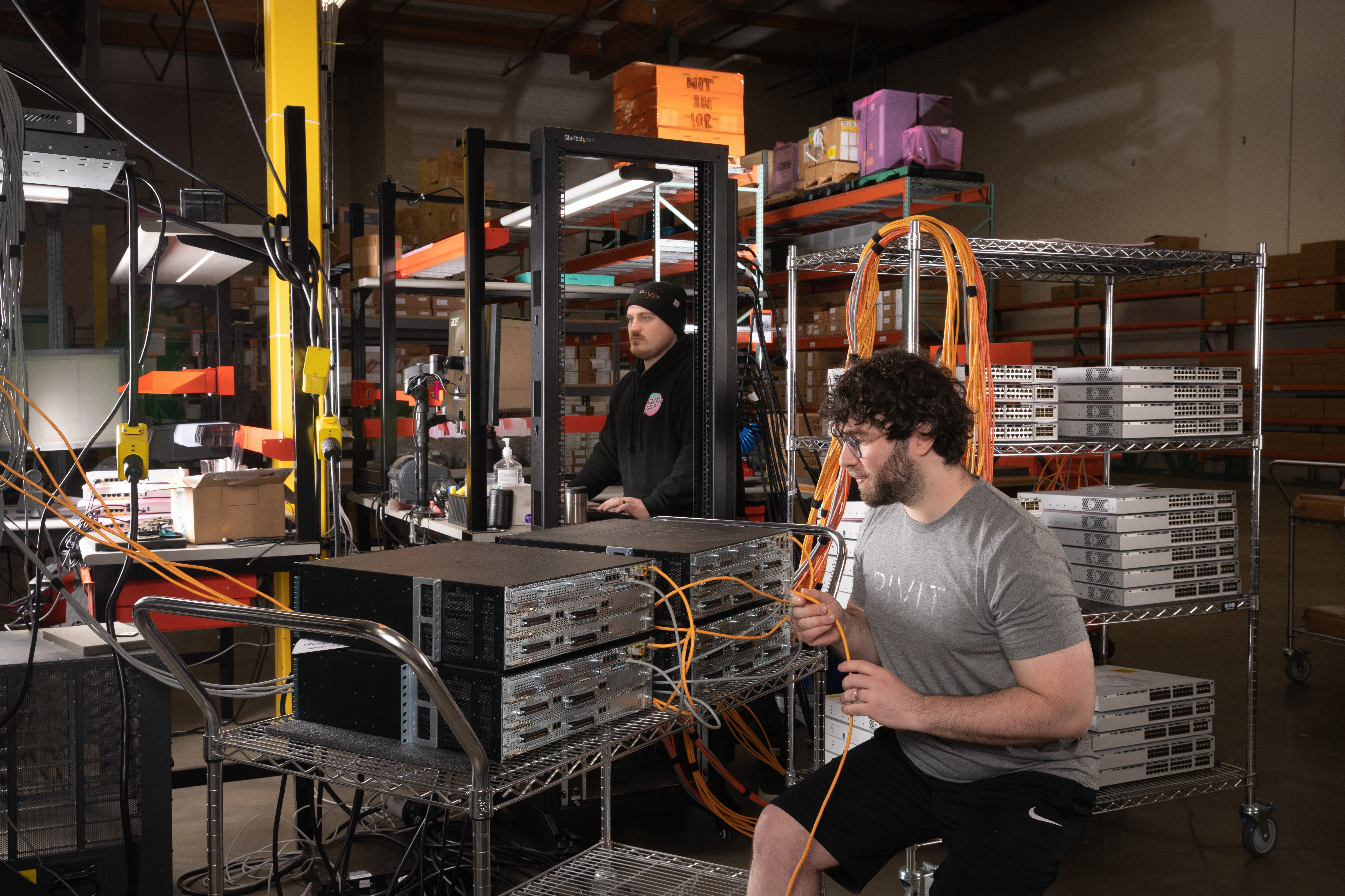 pivit technician working on server rack 